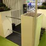 A demo of our new fence system for exhibitions, conferences and events. Suitable for use indoors and outdoors, this modular system consists of a series of pillars, solid panels and chrome rails that can be dressed in aggregate, plants and branded with flags and banners